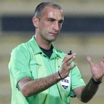Referee Sabbagh gestures during the AFC Cup soccer match between Kuwait's Al Qadsia and Yemen's Al Saqr in Kuwait City