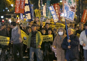 Protesters shout slogans during a march against the government's planned secrecy law in Tokyo