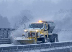 A snow plow clears the road of snow along the New York State Thruway Interstate 87 in Tarrytown