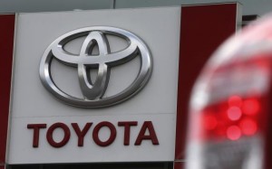 A sign with a logo is on display at a Toyota car sales and sho room in St. Petersburg