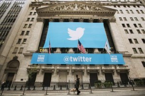 A sign displays the Twitter logo on the front of the New York Stock Exchange ahead of the company's IPO in New York