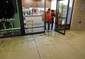 La Habra business owners Ray Aguirre and Sherry Kim check out quake damage