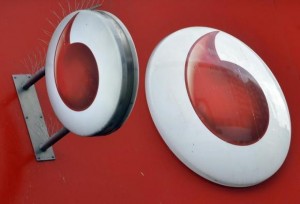 Vodafone branding is seen outside a retail store in London