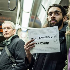 Jason Ware campaigns against Rahm Emanuel on the el. SARAH-JI PHOTOGRAPHY