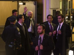 Vice President-elect Mike Pence, top center, leaves the Richard Rodgers Theatre after a performance of "Hamilton" on Friday.